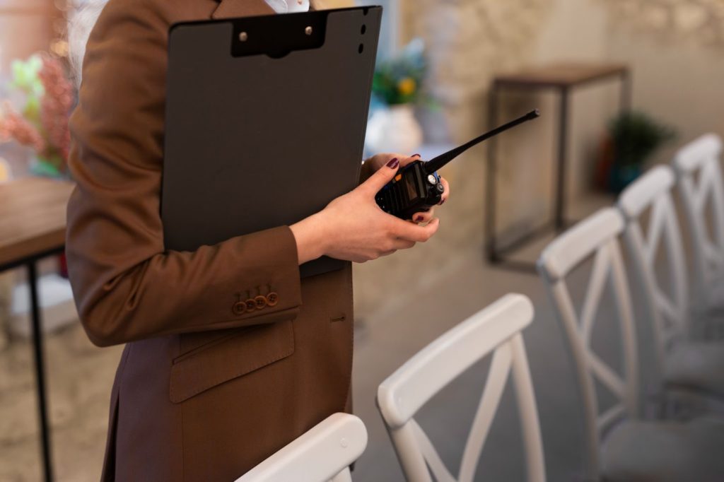 professional event planner with a radio