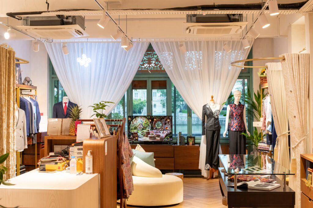 A man and woman sections in a tailors store